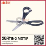 GUNTING PEMOTONG MOTIF KULIT BENTUK SETENGAH LINGKARAN